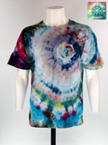 Front view of our Artisan Utility pocket Tee. "Hidden Supernova" explores the moment of a star's rebirth. The design features a swirling vortex of celestial blues, soft pinks, and deep magentas that radiate out from the pocket. Using a specialized ice-crystallization technique, the pigments separate to create intricate, wispy "nebula clouds" across the torso.