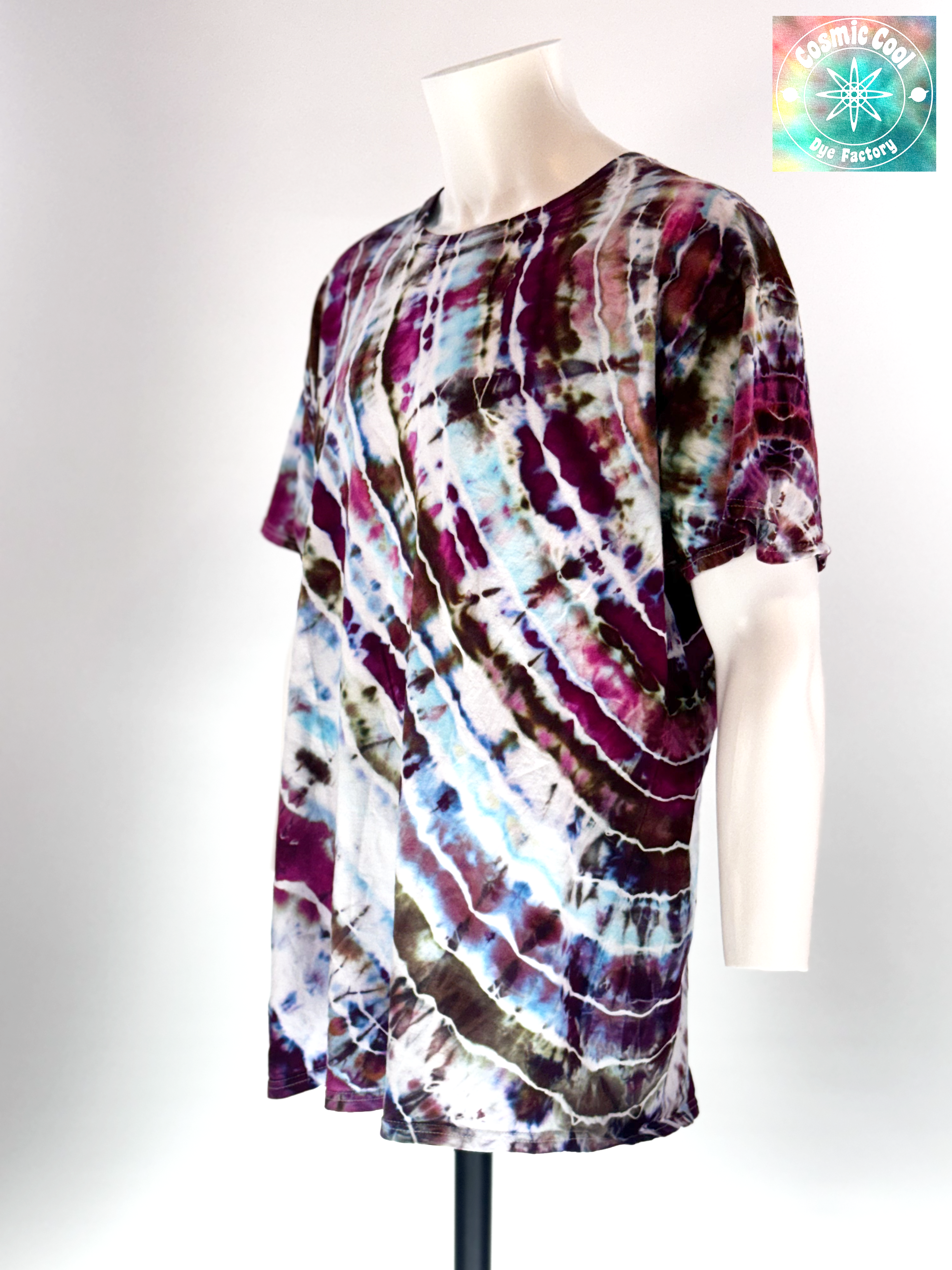 Angled 3/4 Front view of a 3XL Short Sleeve Artisan Tee. Titan's Reach features a powerful, dream-like quality. Imagine deep charcoal and slate "stone" textures being shattered by veins of molten gold and cooling embers. Creating a sense of tactile depth, as if the color is physically emerging from the rock itself.
