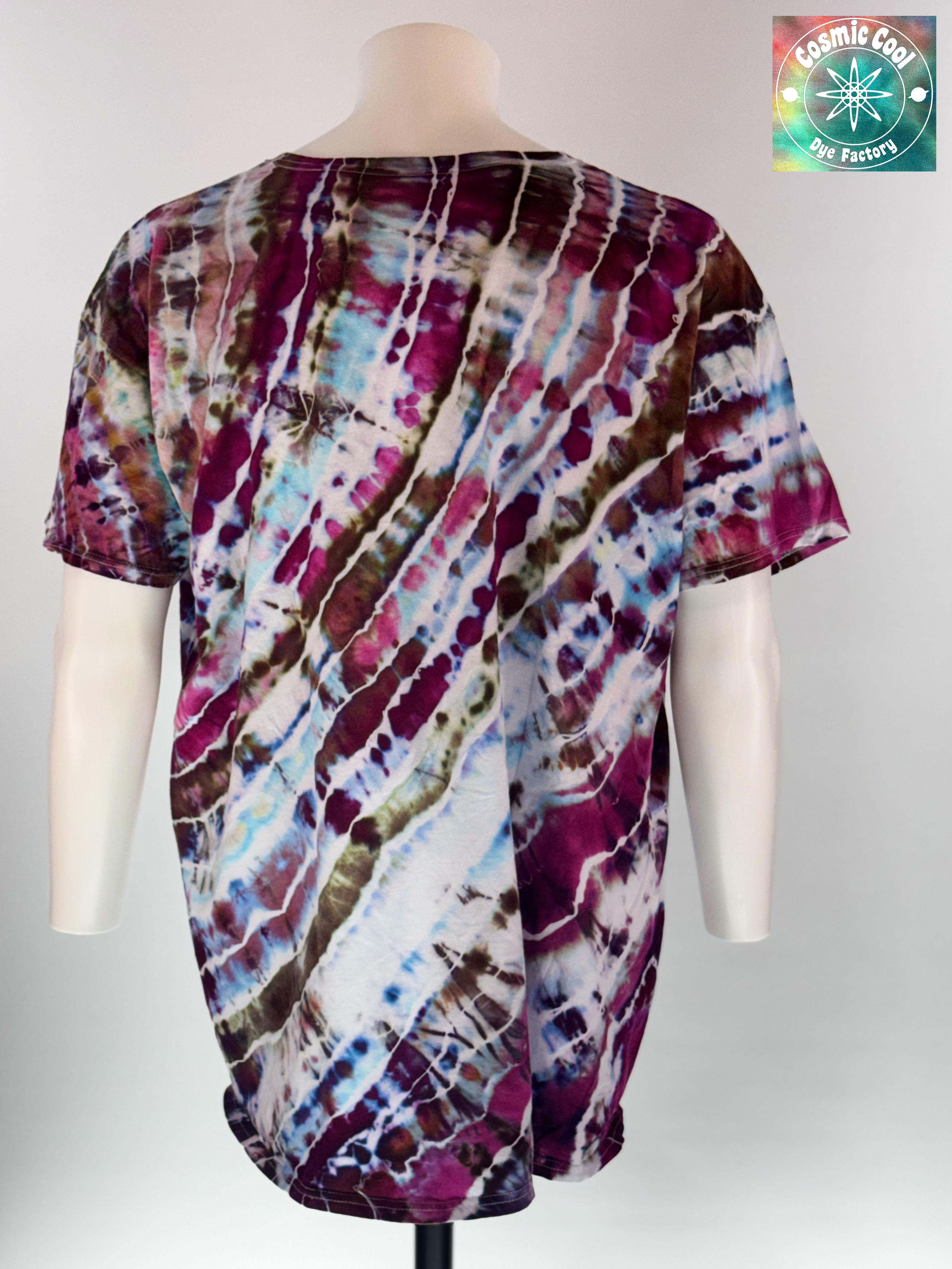 Back view of a 3XL Short Sleeve Artisan Tee. Titan's Reach features a powerful, dream-like quality. Imagine deep charcoal and slate "stone" textures being shattered by veins of molten gold and cooling embers. Creating a sense of tactile depth, as if the color is physically emerging from the rock itself.