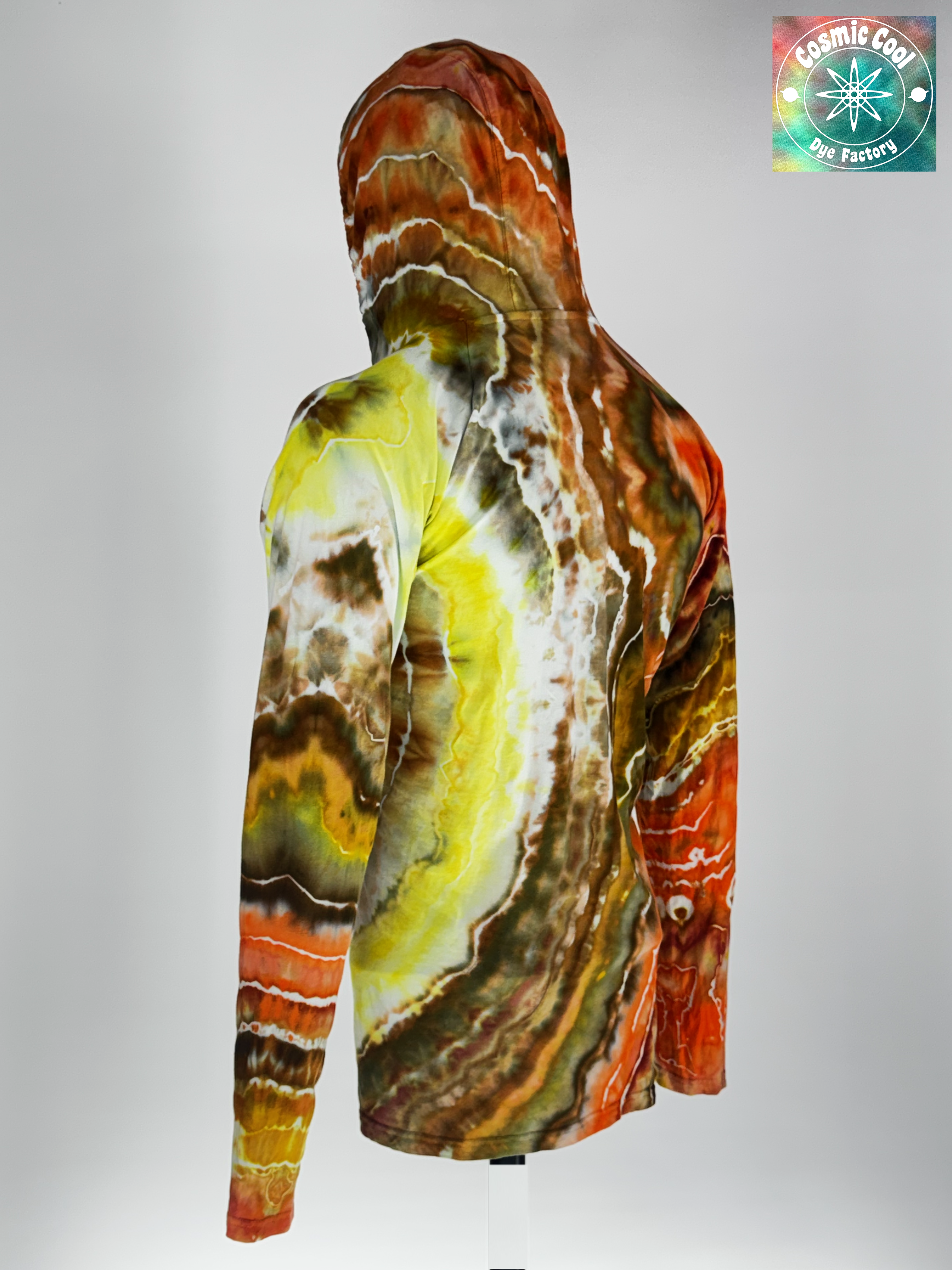 Angled 3/4 back view of 3XL Hooded Artisan Tee. "Solar Flare" features radiant, expanding rings of gold, amber, and deep crimson. The specialized raglan sleeve construction allows the dye patterns to flow naturally from the hood down through the shoulders without interruption, creating a seamless landscape of color.