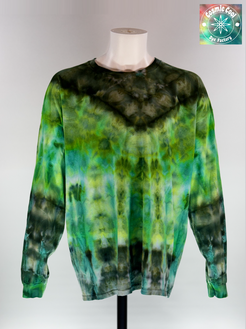 Front view of a 3XL Long Sleeve Ice Dye T-shirt. The design features a dark green crystalline patterns radiating across a luminescent field of emerald green.