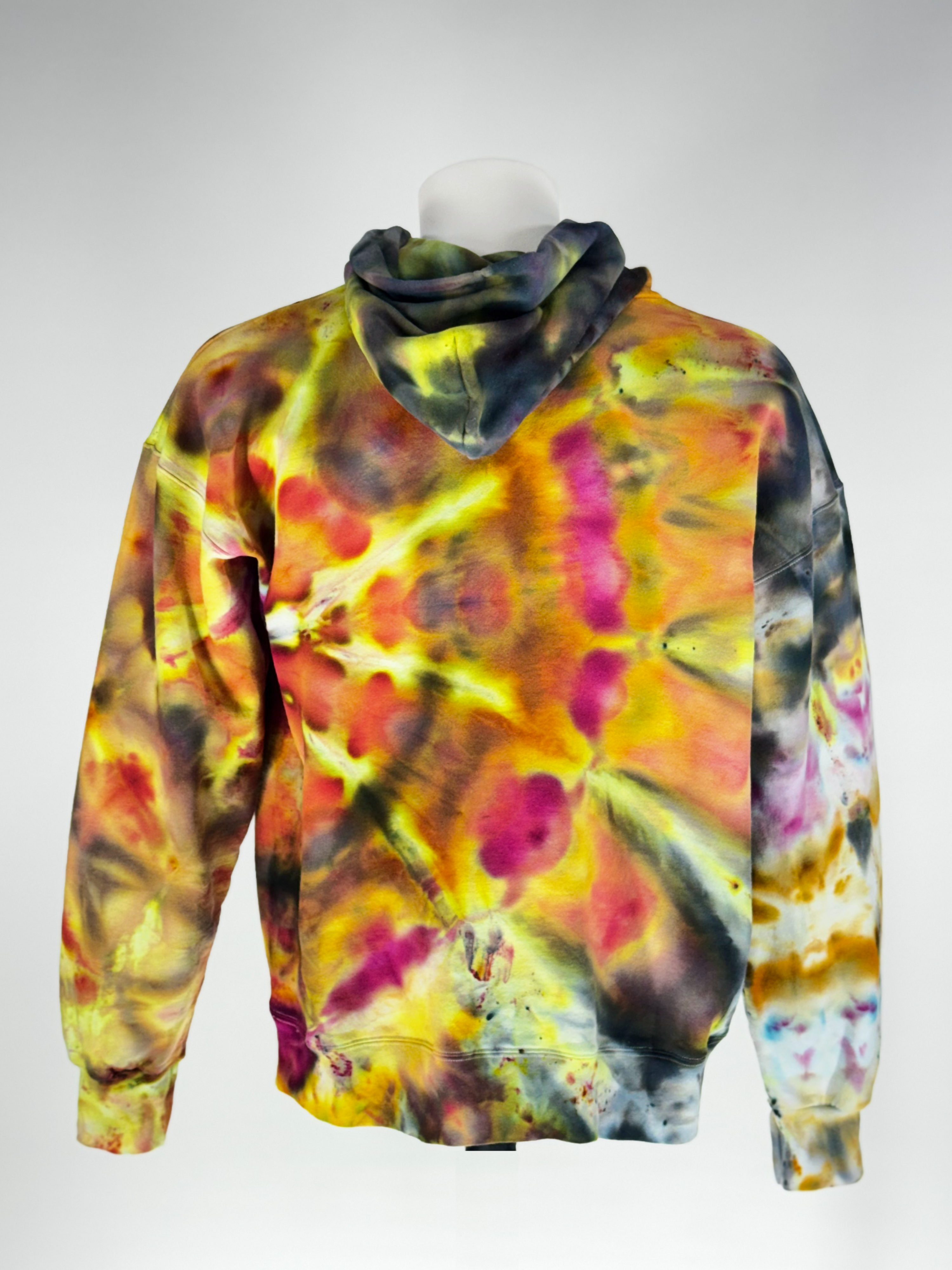 Back view on a headless mannequin of our Large heavyweight hoodie, Supernova Yellowstar" captures the explosive energy of a collapsing star. The crystalline patterns imprints intense solar yellows and brilliant golds fracture through deep space-shadows. The result is a vibrant, "glowing" effect that feels radiant even in low light.
