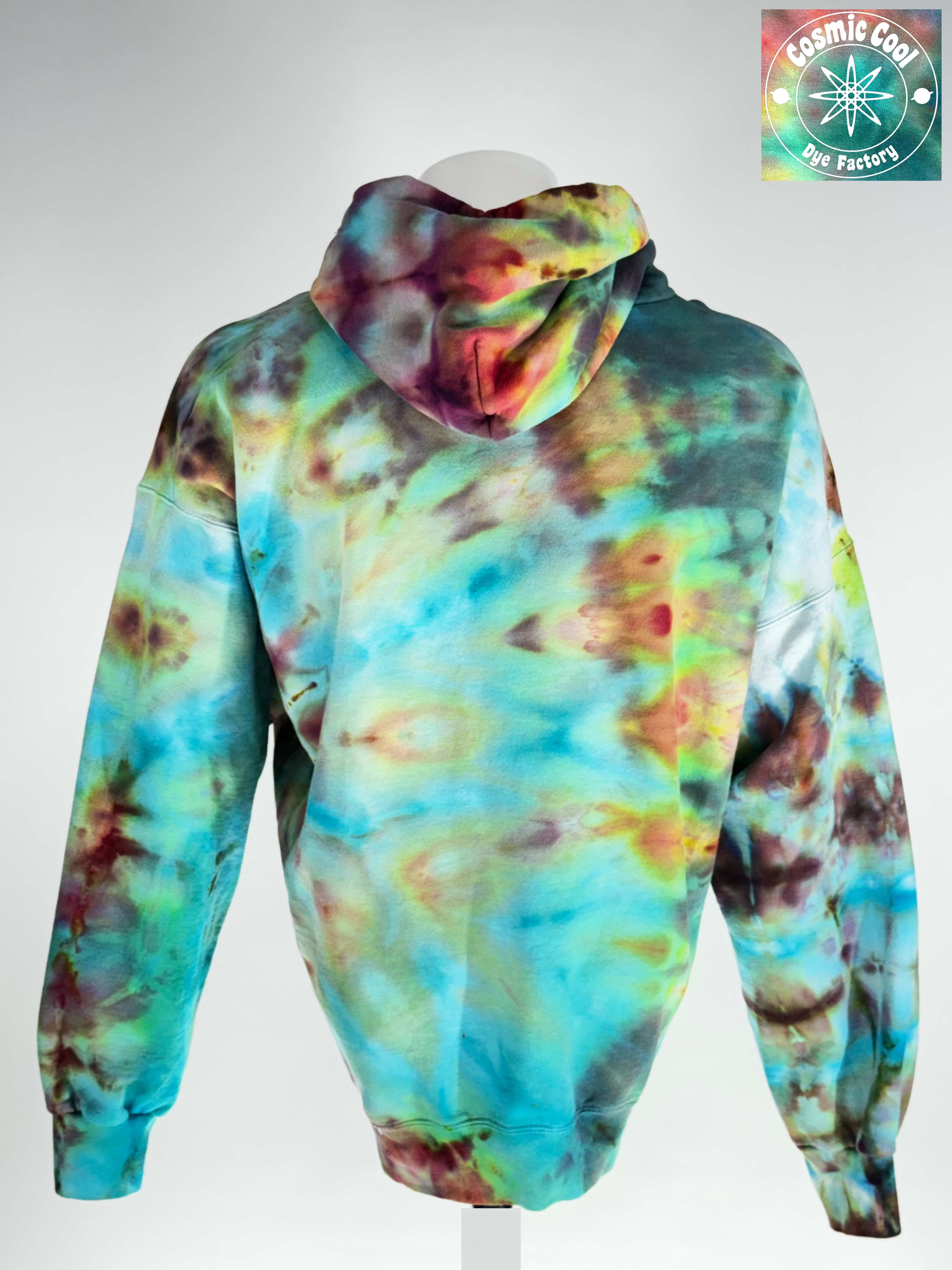 Back  view of a 2XL Ice-dyed Heavyweight Hoodie.The Vision: "Bioluminescent Void" explores the intersection of total darkness and organic light. The pigments seem to fracture out to a deep obsidian base, with "glowing" crystalline structures in neon-adjacent violets and electric teals. 
