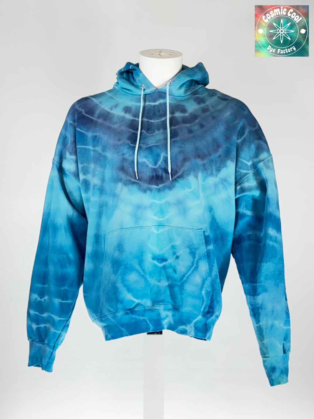 Front view of our 3XL Heavyweight Hoodie. "Glacial Fracture" mimics the tectonic shifting of an ancient ice shelf. We have allowed pigments to fracture a landscape of deep arctic blues and electric teals "shattered" by veins of brilliant, crystalline white.