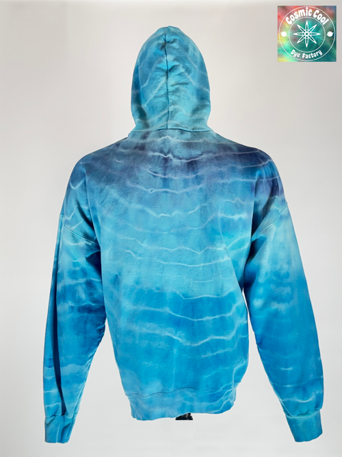 Back view of our 3XL Heavyweight Hoodie.  "Glacial Fracture" mimics the tectonic shifting of an ancient ice shelf. We have allowed pigments to fracture a landscape of deep arctic blues and electric teals "shattered" by veins of brilliant, crystalline white.