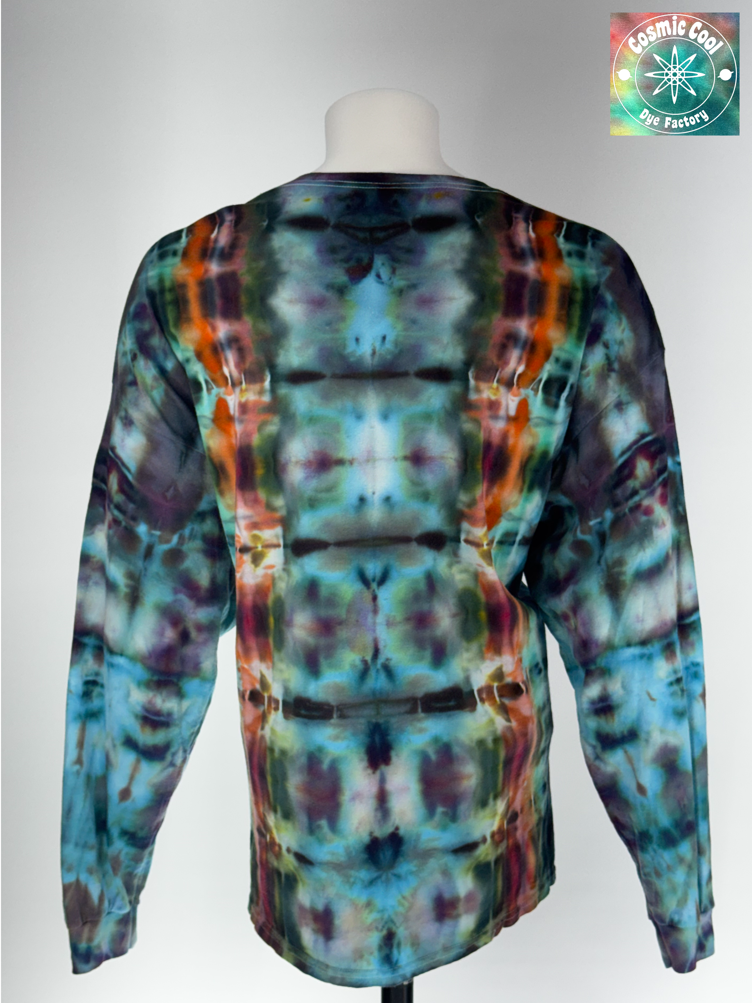 Back view of a 3XL long-sleeve ice dye T-shirt featuring the 'Solar Alchemist' design. Intricate, crystalline ice dye patterns in deep amber and burnt orange radiate across a bright, golden-yellow field, creating a high-energy, sun-like quality