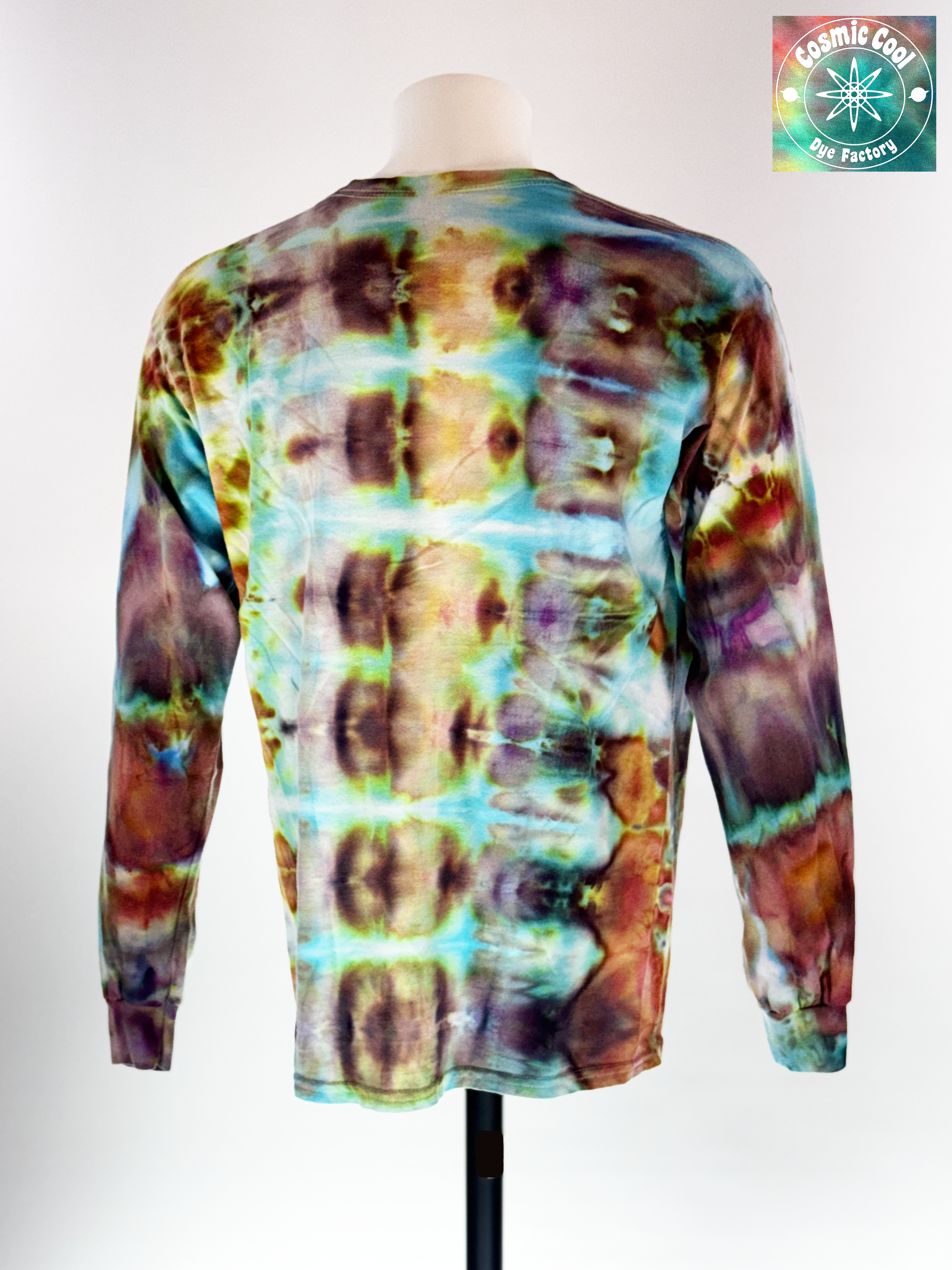 Back view of a Large Long Sleep Ice Dye Artisan Shirt. Phoenix Transformation features a complex, mirrored horizontal pattern. The design explores the elemental shift from deep, scorched umbers and charcoals into vibrant bursts of teal and ethereal light, capturing the very moment of a Phoenix's renewal.