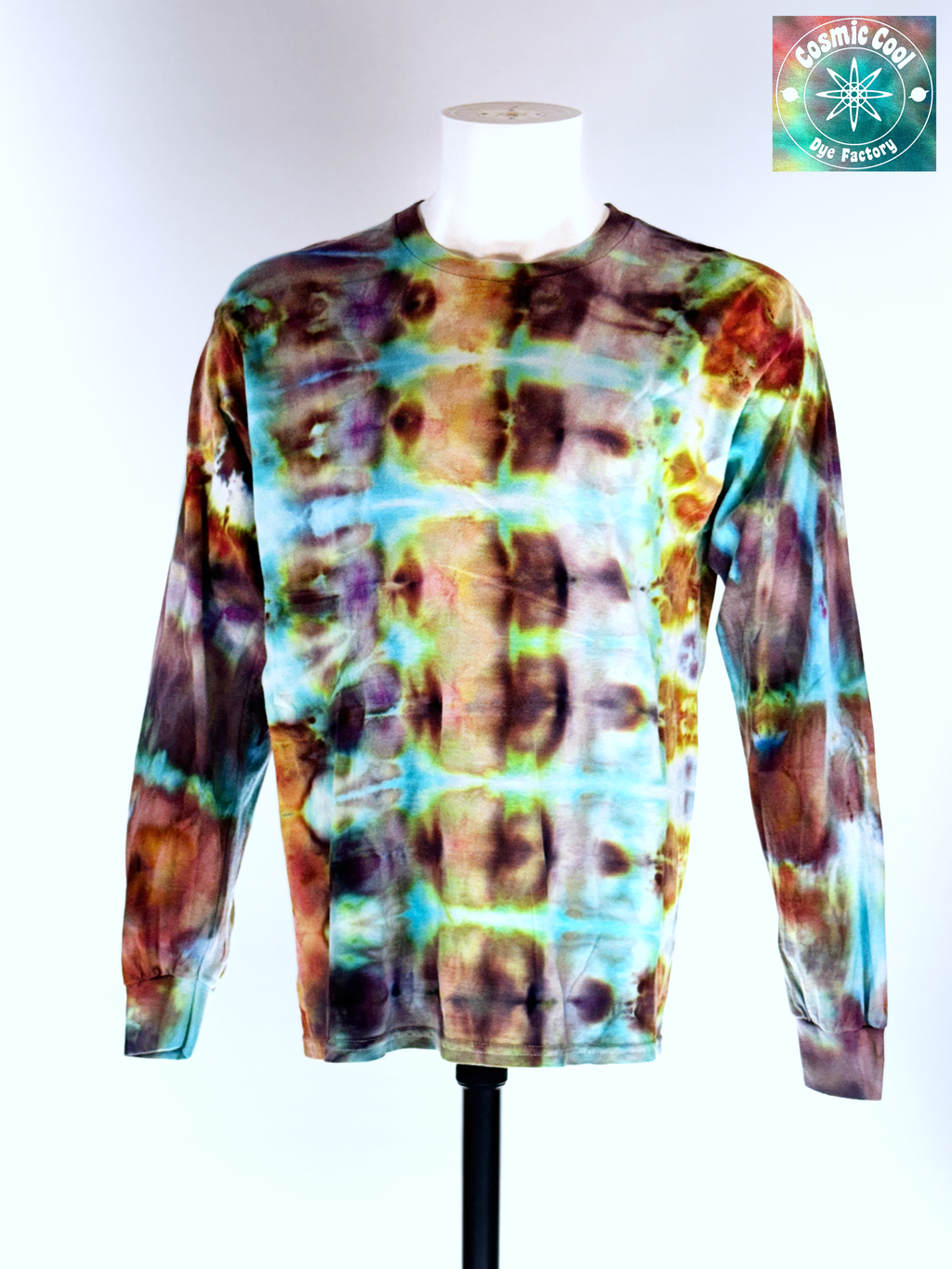 Front view of a Large Long Sleep Ice Dye Artisan Shirt. Phoenix Transformation features a complex, mirrored horizontal pattern. The design explores the elemental shift from deep, scorched umbers and charcoals into vibrant bursts of teal and ethereal light, capturing the very moment of a Phoenix's renewal.