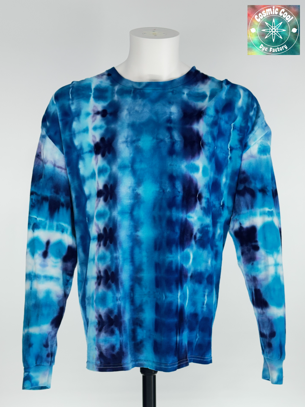 Front view of 2XL Long Sleeve Artisan Tee. Glacial Voyagers" captures the sweeping scale of an arctic landscape. The design features horizontal "drifts" of icy turquoise and deep cerulean, broken by jagged, crystalline lines of white and soft lavender. The ice-dye creating a continuous "voyage" of color that feels vast in its detail.