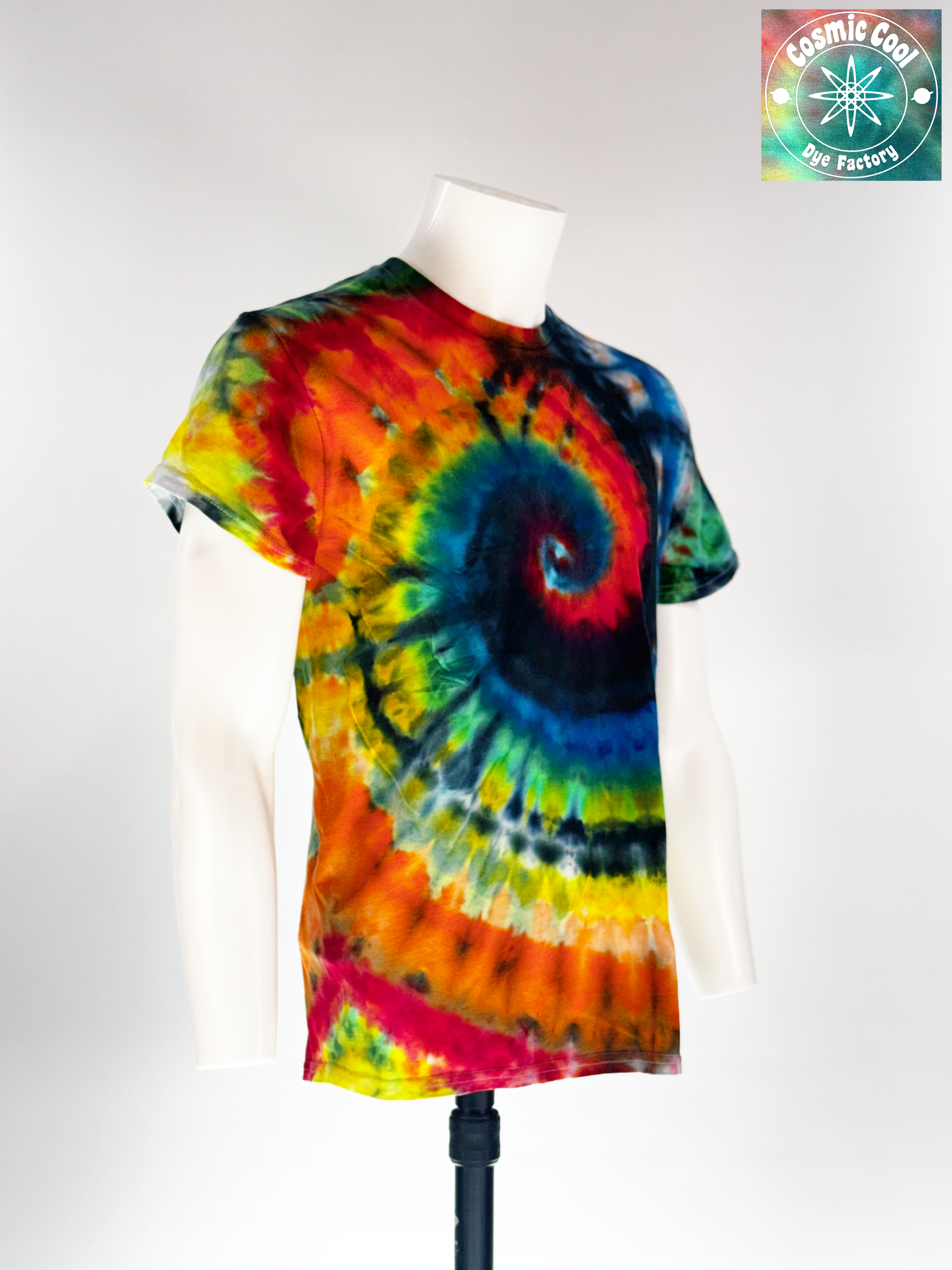 Video of spinning Medium Short sleeve artisan tee. Event Horizon features a high-saturation, multi-color spiral that creates a sense of powerful gravity. Intense crimsons, neon yellows, and electric blues are pulled into a deep indigo and obsidian core, mimicking the edge of a celestial phenomenon.