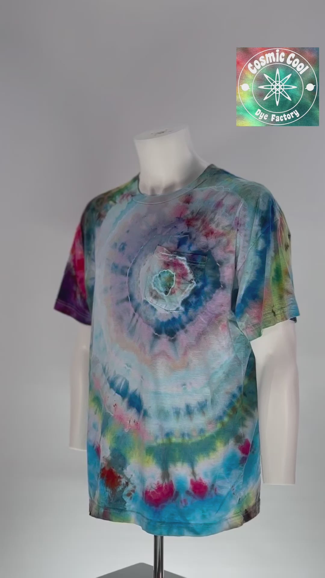 Video of our Artisan Utility pocket Tee. "Hidden Supernova" explores the moment of a star's rebirth. The design features a swirling vortex of celestial blues, soft pinks, and deep magentas that radiate out from the pocket. Using a specialized ice-crystallization technique, the pigments separate to create intricate, wispy "nebula clouds" across the torso.